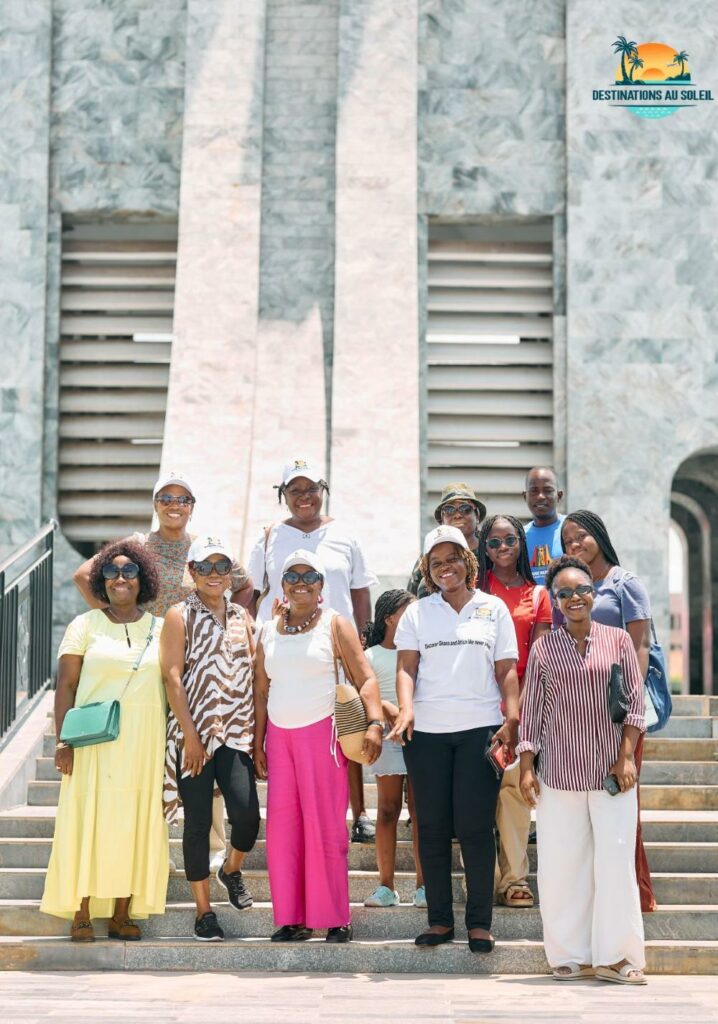 Happy tourists enjoying an Accra city tour in Ghana with Destinations au Soleil